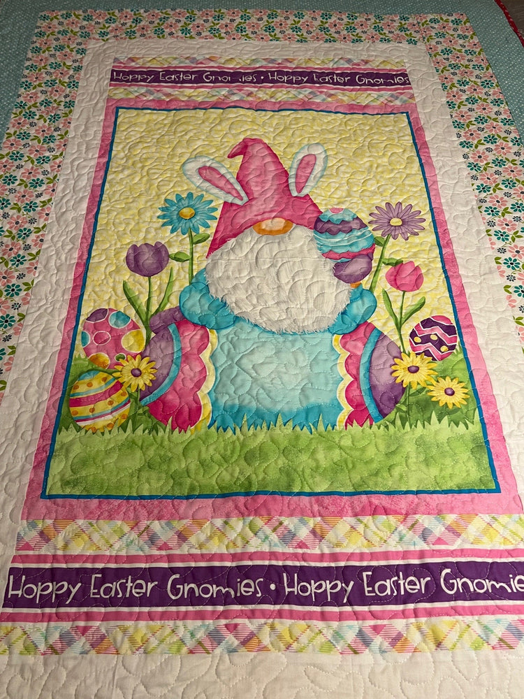 Handmade quilt from Quilts and Blankets featuring a pink Easter bunny, colorful eggs, flowers, and a pastel border.
